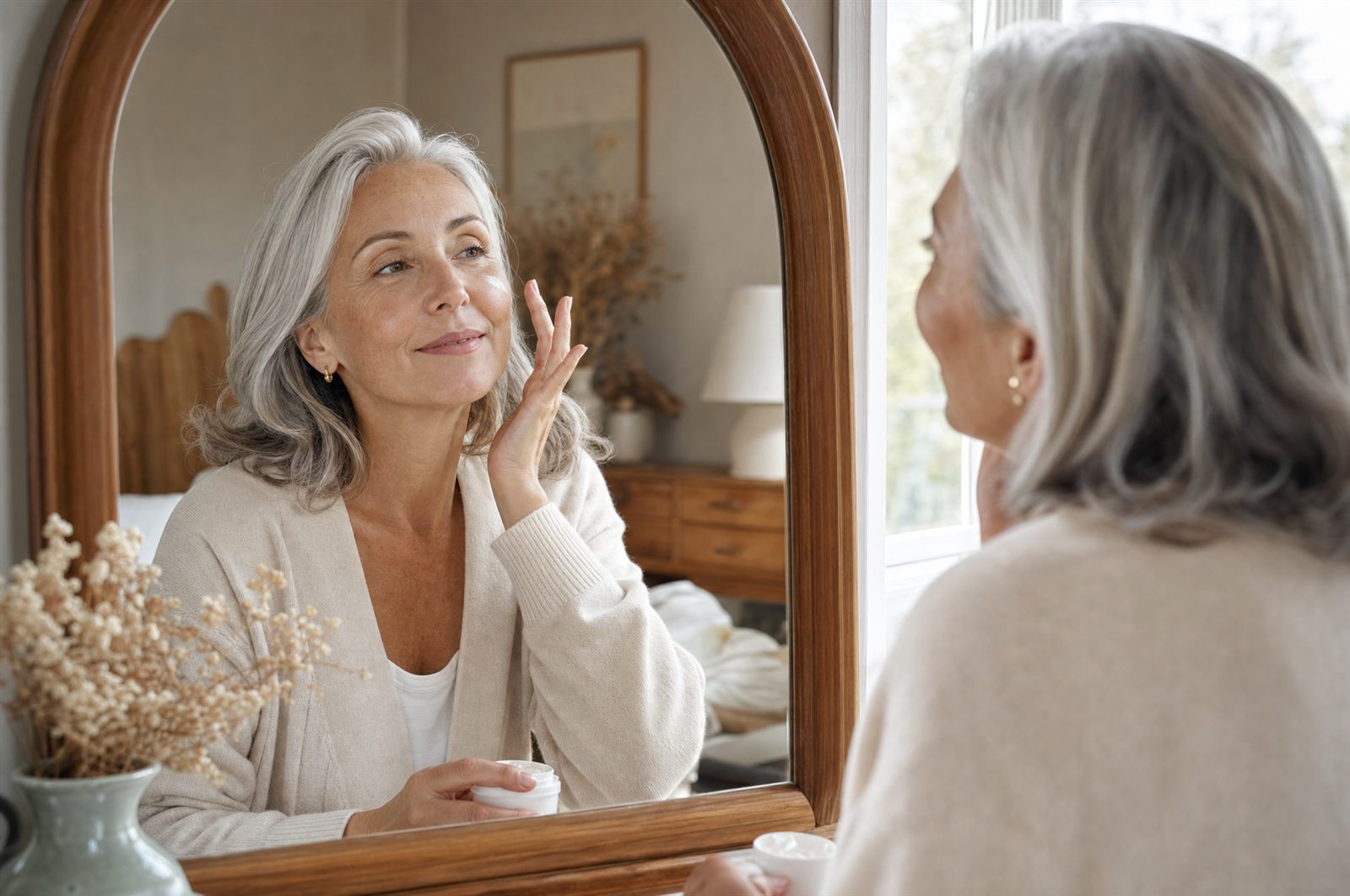 Woman applying sunscreen in morning light